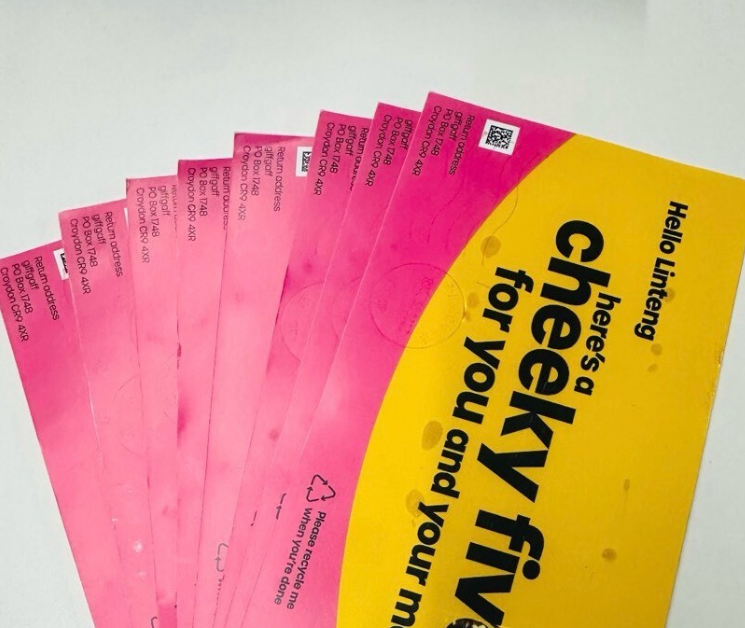 Stack of pink and yellow promotional mailers addressed to Linteng with text Hello Linteng heres a cheeky fiver for you and...