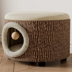 Round cat house ottoman with tree bark texture, plush entrance hole, and hanging sisal ball toy